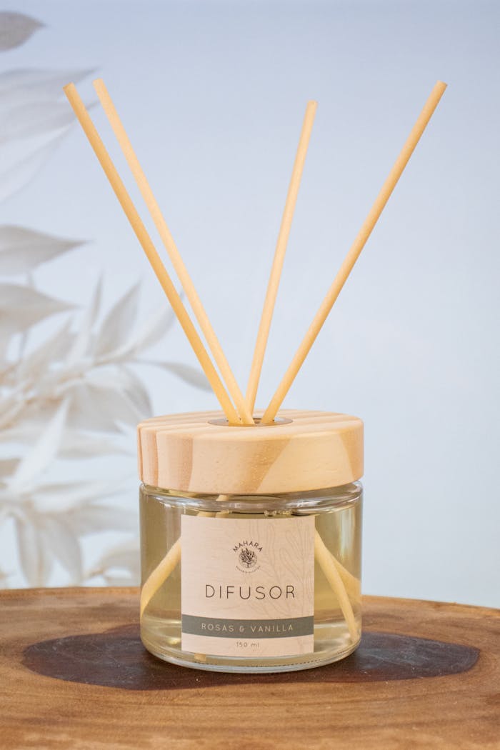 Elegant reed diffuser bottle with natural aroma sticks for home fragrance.